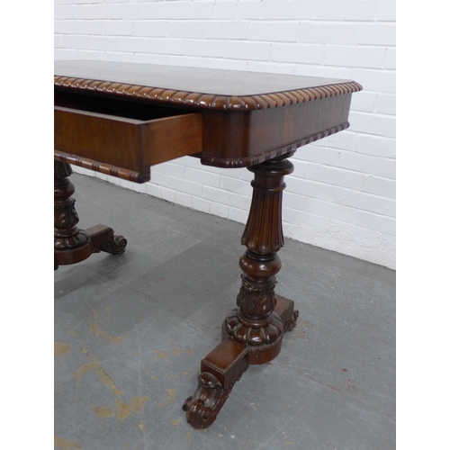 205 - 19th century rosewood table, the rectangular top with gadrooned edge, over two short frieze drawers,... 