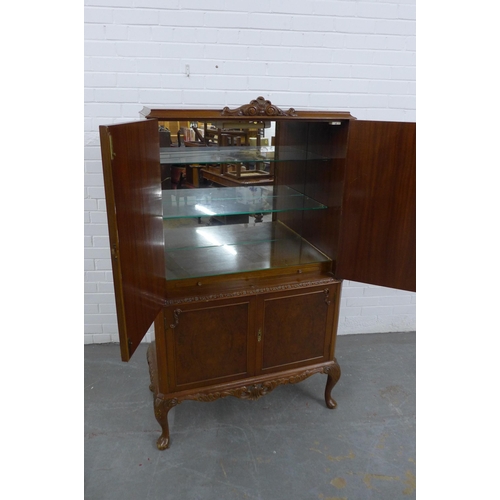 210 - Queen Anne style walnut drinks cabinet with four doors, glass shelved interior to top, raised  on sh... 