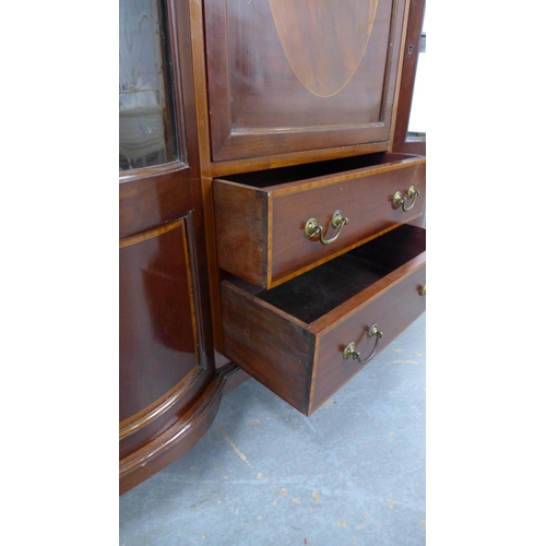 211 - Mahogany and inlaid display cabinet, inverted top over a central cupboard door and two short drawers... 