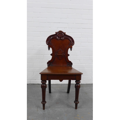 213 - Mahogany hall chair with carved shield back, solid seat and fluted legs, 89 x 45 x 37cm.