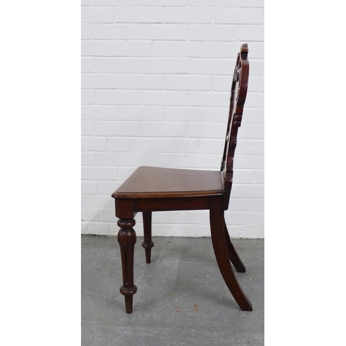 213 - Mahogany hall chair with carved shield back, solid seat and fluted legs, 89 x 45 x 37cm.