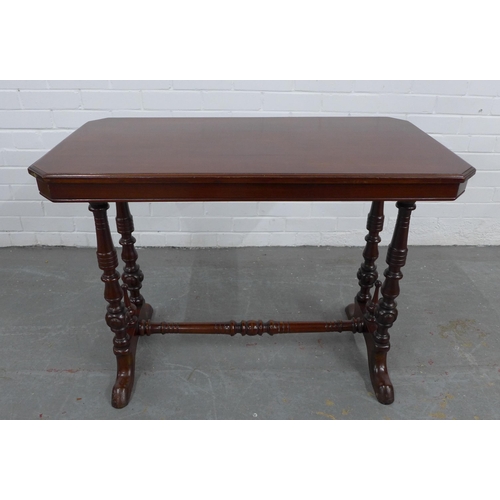 214 - Mahogany writing / side table, rectangular top with canted corners, on twin supports with ring turne... 