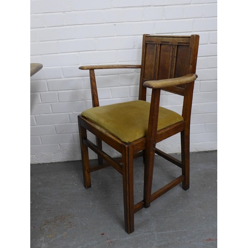 220 - An Ercol oak dining table and set of six Jacobean style chairs with slip in seats. 72 x 153 x 77cm. ... 