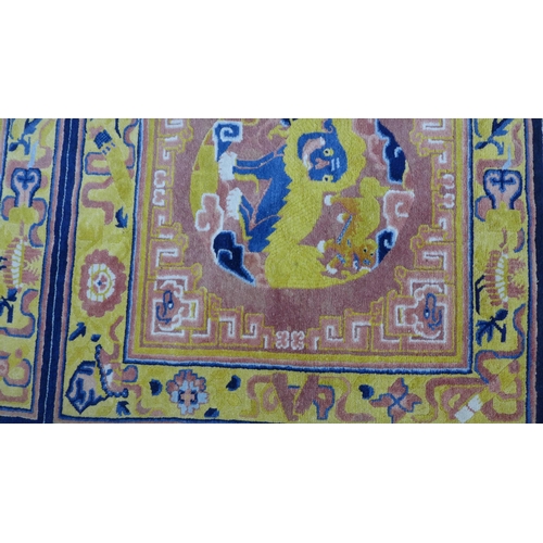 229 - Chinese rug, two panels with kylins and stylised border . 160 x 83cm.