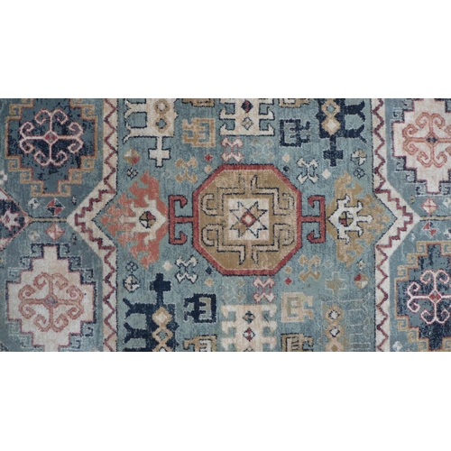 230 - Persian rug with olive field and geometric motifs, 201 x 134cm.