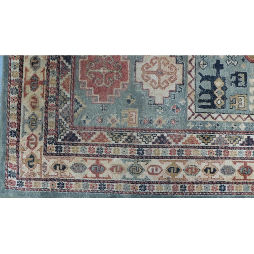 230 - Persian rug with olive field and geometric motifs, 201 x 134cm.