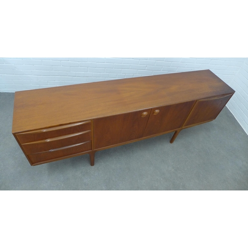 233 - A.H. McIntosh, teak sideboard with a pair of cupboard doors, flanked on one side to a fall front, an... 