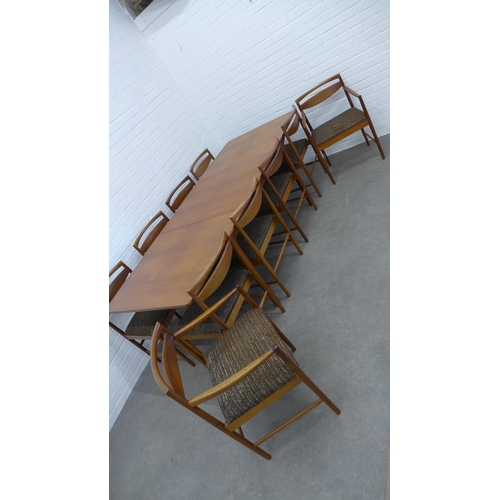 234 - A.H. McIntosh teak extending dining table and set of ten chairs. 73 x 241 x 90cm. (11)