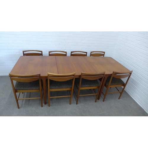 234 - A.H. McIntosh teak extending dining table and set of ten chairs. 73 x 241 x 90cm. (11)