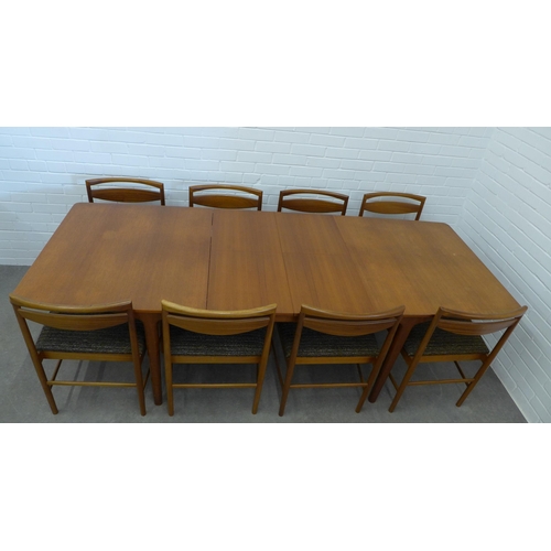 234 - A.H. McIntosh teak extending dining table and set of ten chairs. 73 x 241 x 90cm. (11)