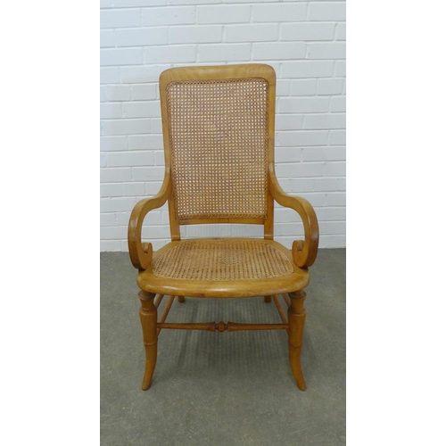 241 - Light mahogany open armchair, canework back and set, (A/F) 92 x 52 x 49cm.