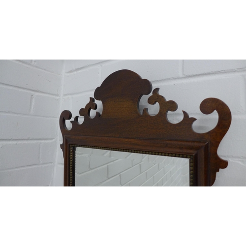 242 - Mahogany fretwork wall mirror 82 x 42cm.