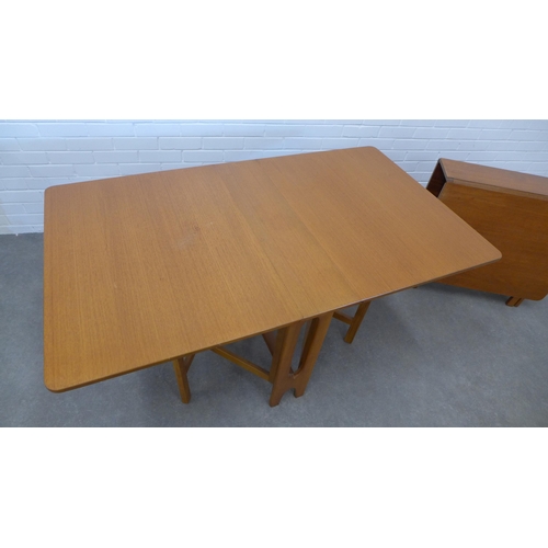 243 - Two teak drop leaf tables. 74 x 144 x 83cm. (2)