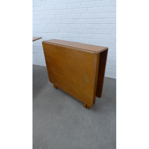 243 - Two teak drop leaf tables. 74 x 144 x 83cm. (2)