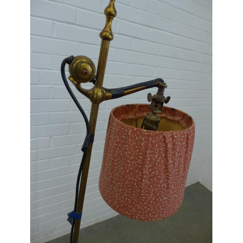 250 - Early 20th century adjustable brass standard lamp with shade. 150cm.