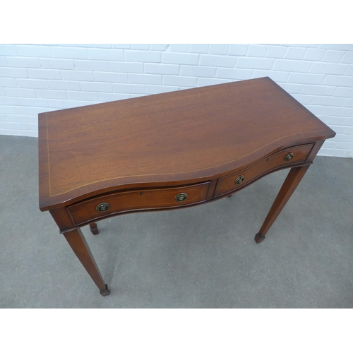 251 - Mahogany serpentine hall / consol table with two central frieze drawers. 86 x 99 x 47cm.