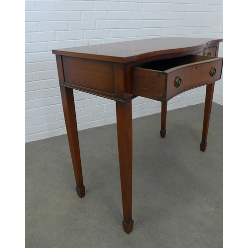 251 - Mahogany serpentine hall / consol table with two central frieze drawers. 86 x 99 x 47cm.