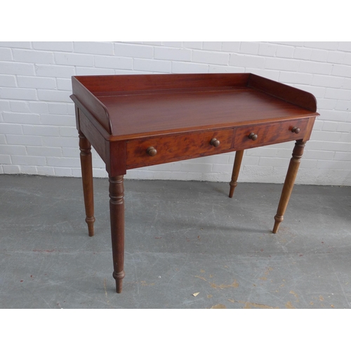 270 - Mahogany ledge back desk/table with two short drawers, bun handles and ring turned tapering legs, 83... 