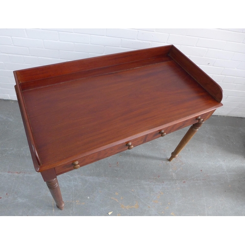 270 - Mahogany ledge back desk/table with two short drawers, bun handles and ring turned tapering legs, 83... 