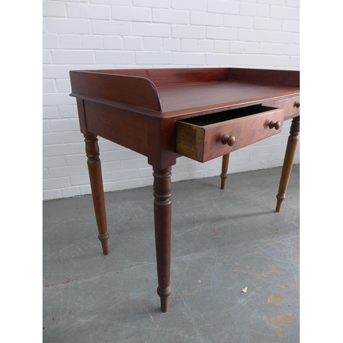 270 - Mahogany ledge back desk/table with two short drawers, bun handles and ring turned tapering legs, 83... 