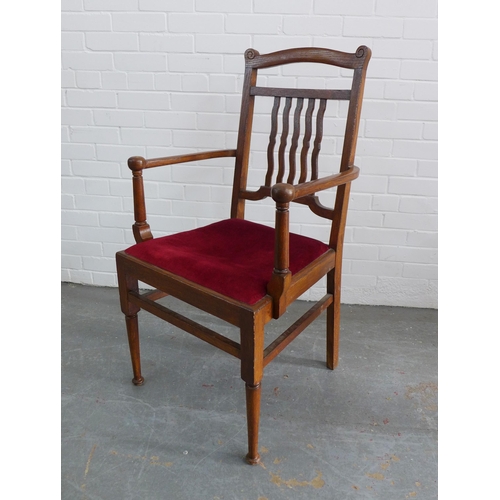 271 - An Arts & Crafts oak open armchair with red upholstered seat, 106 x 58 x 47cm.