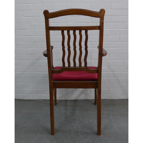 271 - An Arts & Crafts oak open armchair with red upholstered seat, 106 x 58 x 47cm.