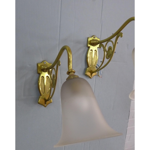 280 - A pair of Art Nouveau style brass wall lights with opaque glass shades (2)