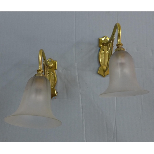 281 - A pair of Art Nouveau style brass wall lights with opaque glass shades (2)