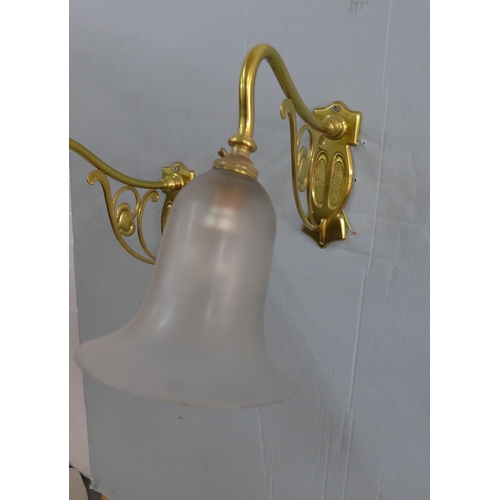 281 - A pair of Art Nouveau style brass wall lights with opaque glass shades (2)