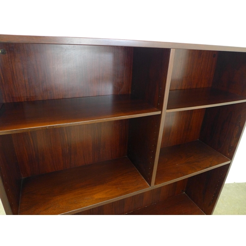 282 - Omann Jun open bookcase on chrome legs, retains label and with cable holes to the back panel, 135 x ... 