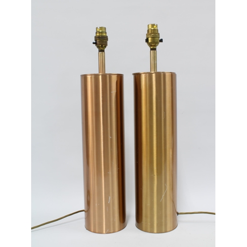 304 - A pair of copper coloured metal table lap bases, (2) 48cm.