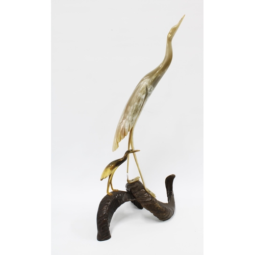 309 - Cow horn model of two birds bird on a rams horn base, 62cm.