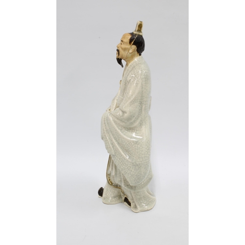 311 - Craquelure glazed figure of a Sage, modelled standing in walking pose, 36cm.