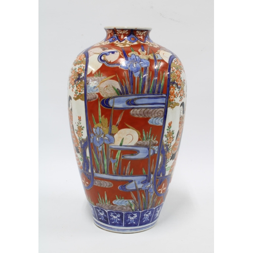 312 - Imari vase typically decorated with figures blossom and foliage, etc 30cm.