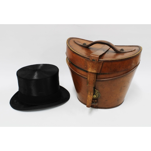 316 - Henry Heath black silk top hat together with a brown leather top hat box (2) 20cm.