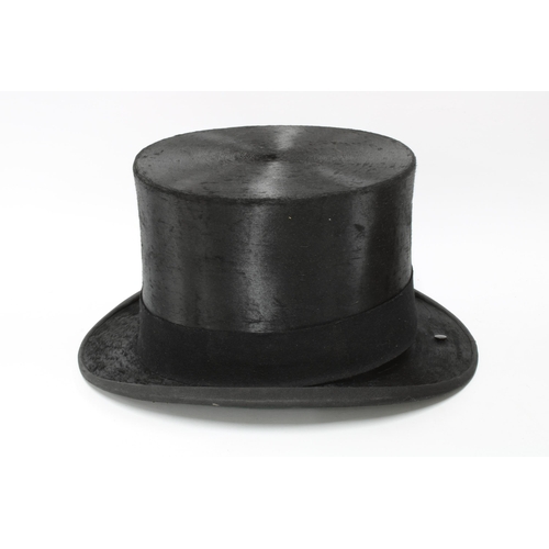 316 - Henry Heath black silk top hat together with a brown leather top hat box (2) 20cm.