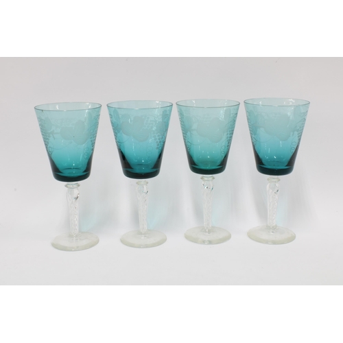 318 - Set of four fruit and vine etched wine glasses with green glass bowls and clear knop stems (4) 20cm.