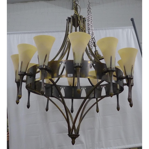 325 - Chelsom bronze patinated chandelier, circular frame with twelve sconce arms with fluted glass shades... 