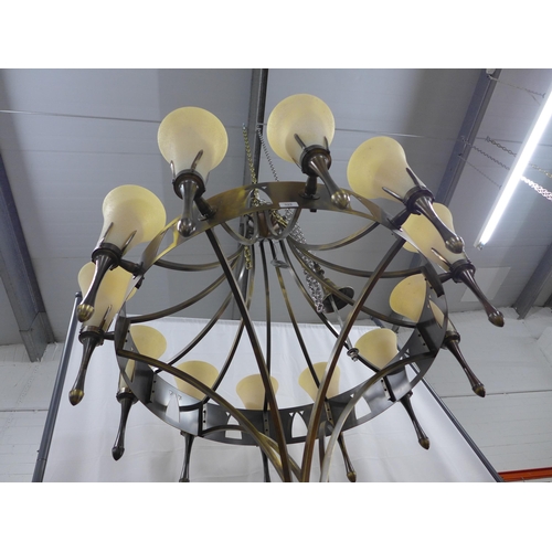 325 - Chelsom bronze patinated chandelier, circular frame with twelve sconce arms with fluted glass shades... 