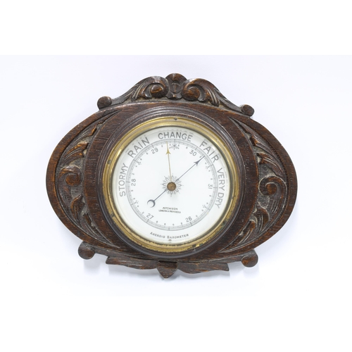 328 - Aitchison carved oak aneroid wall barometer, 23 x 28cm.