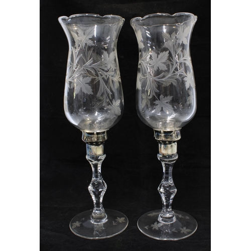 342 - A pair of etched glass storm lantern style candlesticks with silver plated bases (2) 37cm.