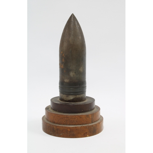 343 - Trench Art shell on a stepped wooden base, 21cm.