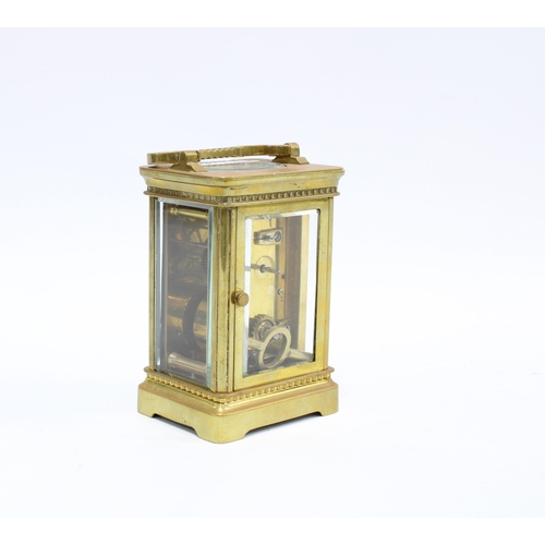 375 - Brass and glass panelled carriage clock, roman numerals, with key, 14cm high including handle