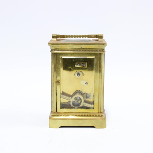 375 - Brass and glass panelled carriage clock, roman numerals, with key, 14cm high including handle