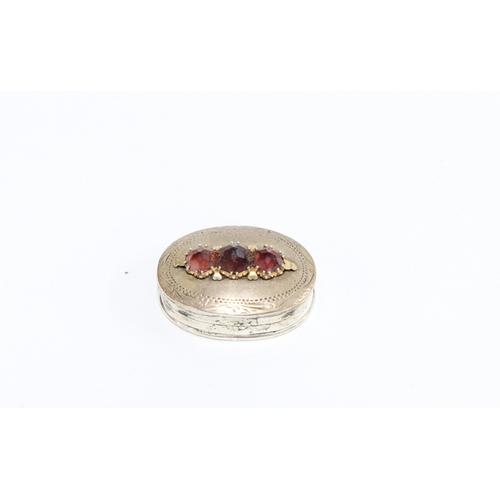 381 - Small silver pill box, the hinged lid with three garnets, stamped 925, 3cm