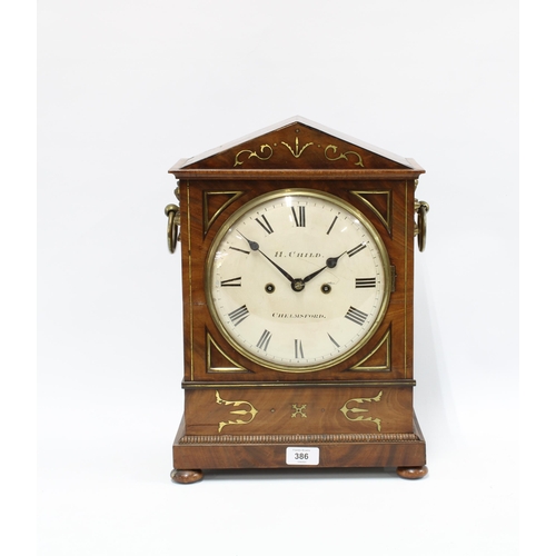 386 - Mahogany mantle clock, the circular dial inscribed H. Child, Chelmsford and with Roman numerals, wit... 