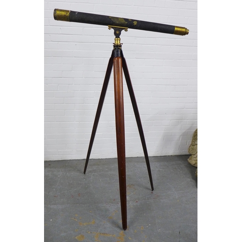 404 - 19th century brass telescope and mahogany tripod stand, 163 x 102cm. (2)