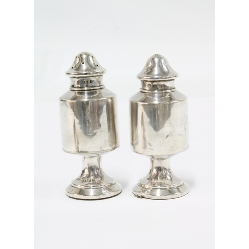 67 - George V silver salt and pepper pots, William Vale, Birmingham 1915 and a Georgian silver caddy spoo... 