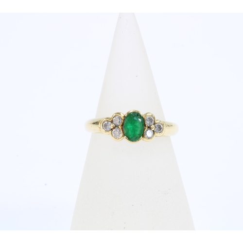 68 - 18ct gold emerald & diamond dress ring, with an oval emerald flanked by three bright cut diamonds, s... 