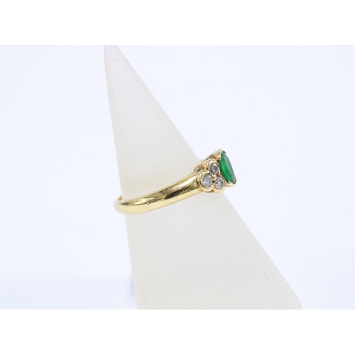 68 - 18ct gold emerald & diamond dress ring, with an oval emerald flanked by three bright cut diamonds, s... 